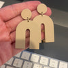 Tan arch earrings